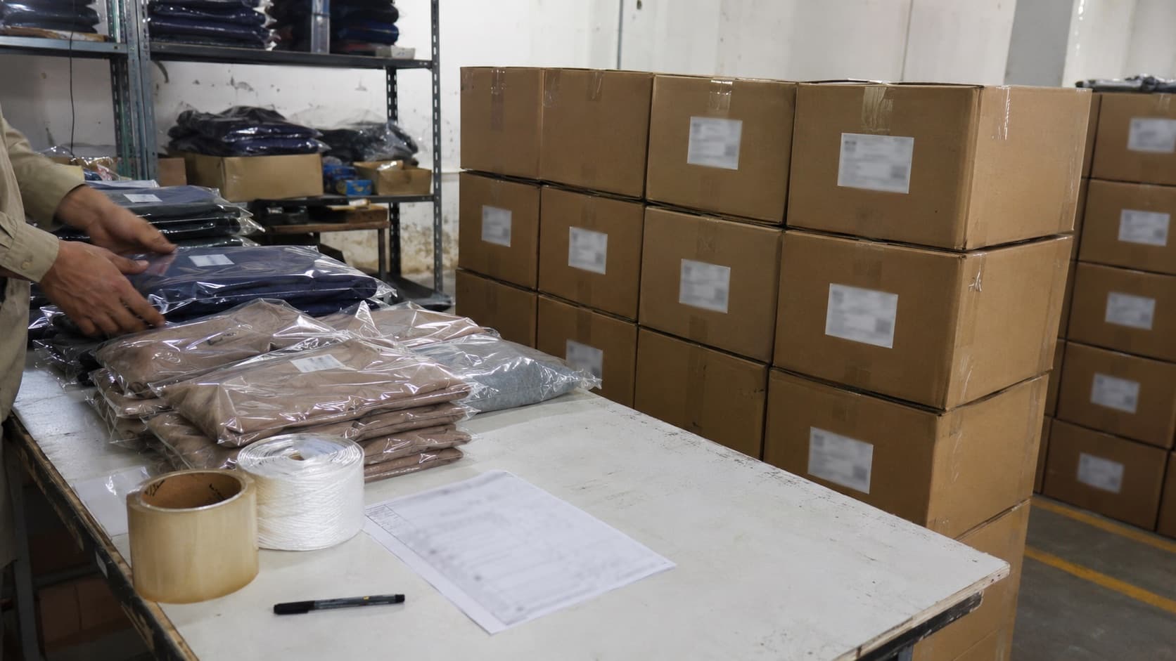 Packed knitwear and cartons prepared for dispatch