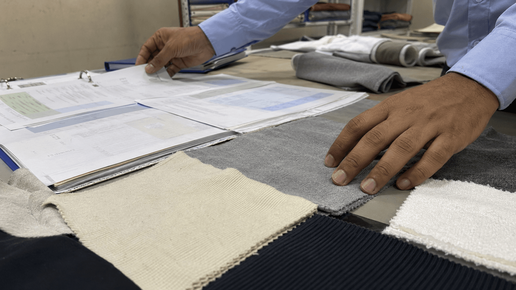 Supplier environmental and certification documents reviewed beside knit fabrics